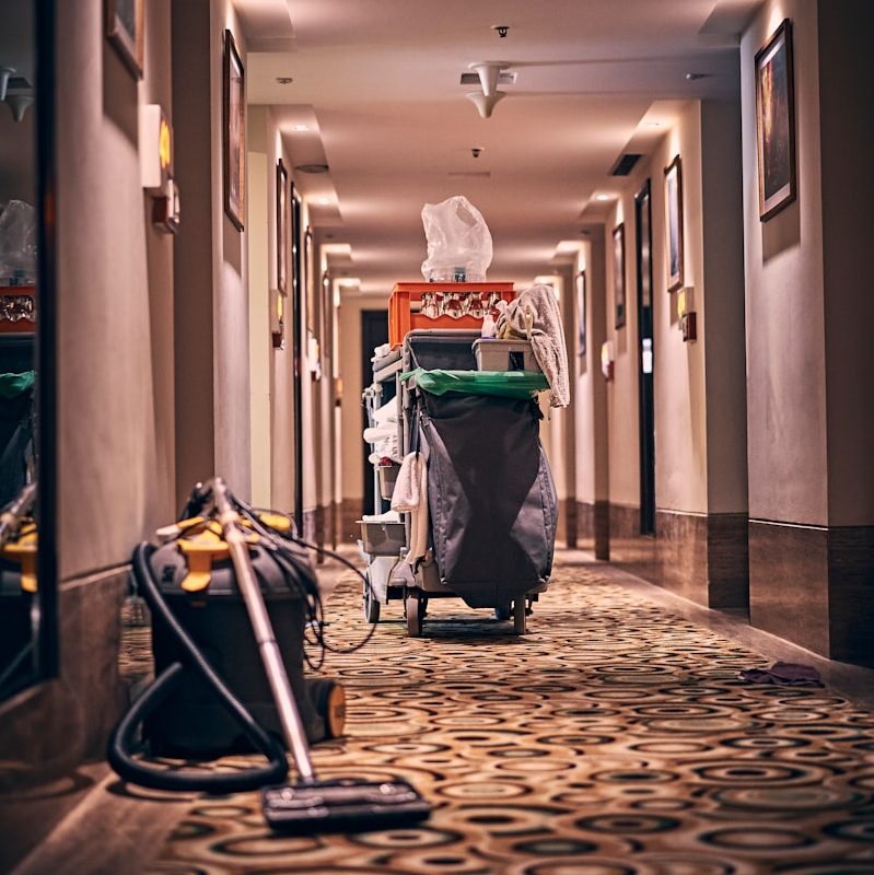 black and gray stroller on hallway